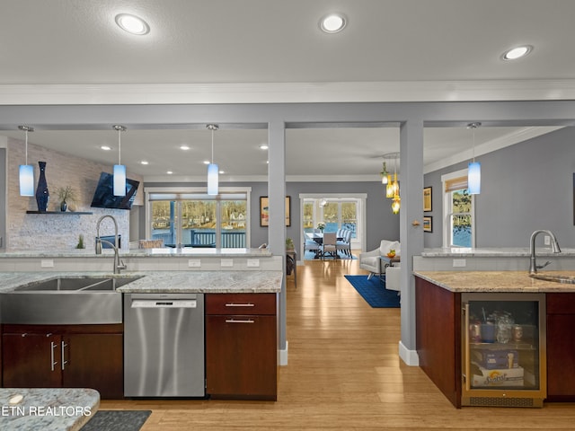 kitchen with wine cooler, sink, ornamental molding, and stainless steel dishwasher