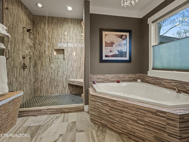 bathroom with independent shower and bath and ornamental molding