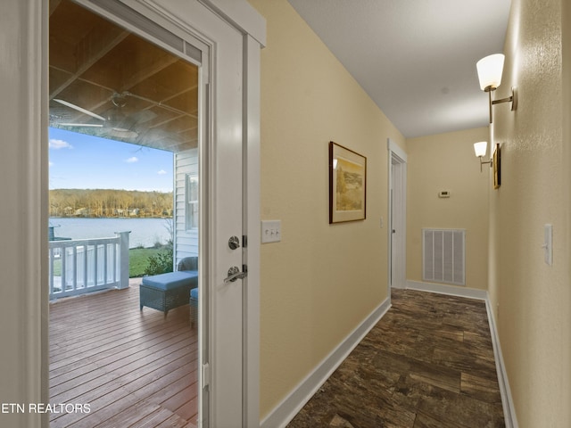 hall featuring a water view and hardwood / wood-style floors