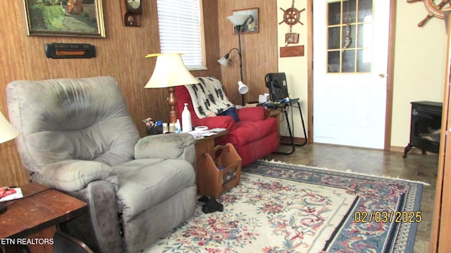 living room with wood walls