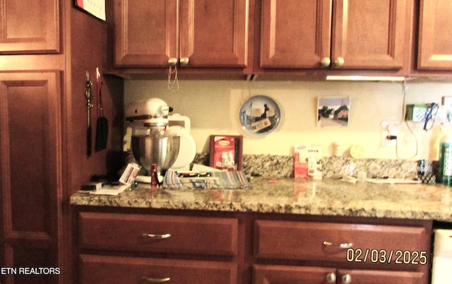 kitchen featuring light stone countertops