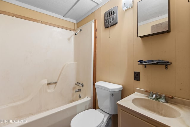 full bathroom with vanity, shower / washtub combination, toilet, and wood walls