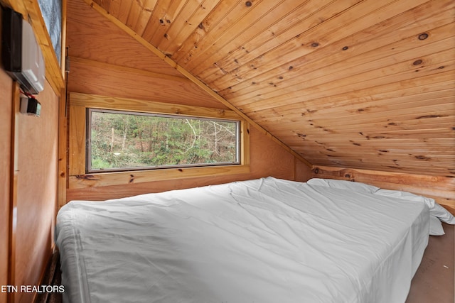 bedroom with lofted ceiling and wooden ceiling