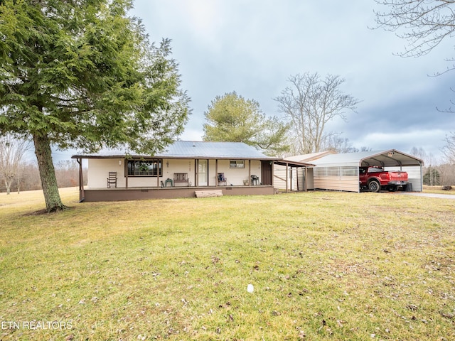 view of front of house with a carport, a front yard, and covered porch