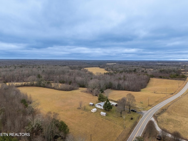 birds eye view of property featuring a rural view