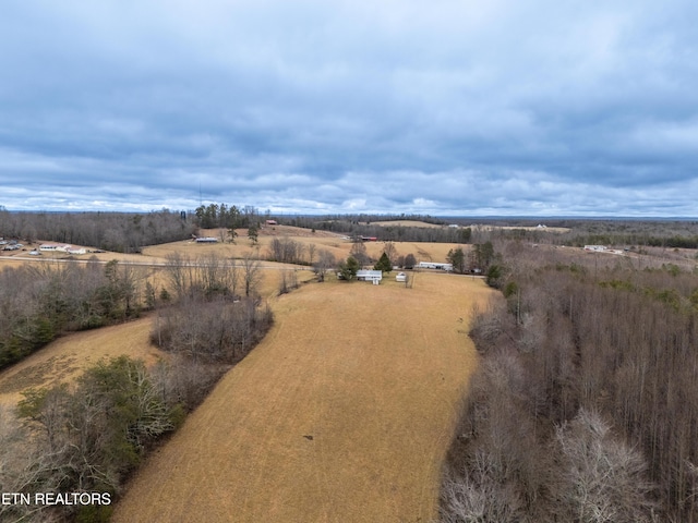 birds eye view of property with a rural view