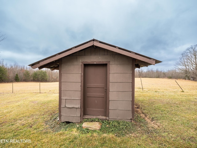 view of outdoor structure with a lawn