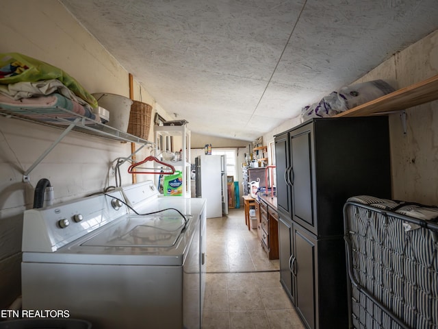 washroom featuring washer and clothes dryer