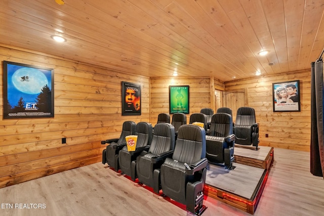 home theater with light wood-type flooring and wooden ceiling