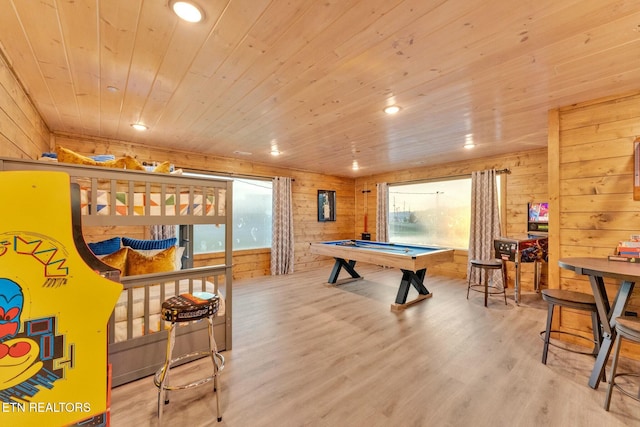 recreation room with billiards, wood walls, wood ceiling, and light hardwood / wood-style flooring