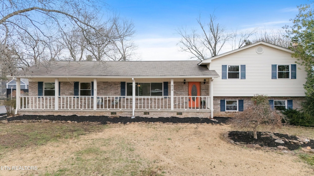 split level home featuring a porch