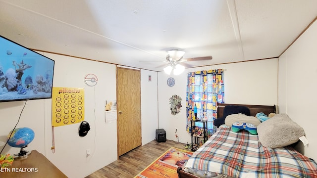 bedroom featuring ceiling fan and light hardwood / wood-style flooring