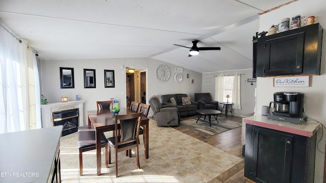 dining room featuring vaulted ceiling and ceiling fan