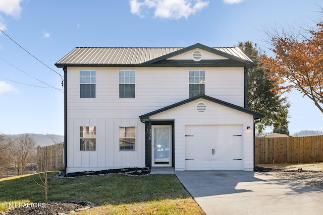 front facade featuring a garage and a front lawn