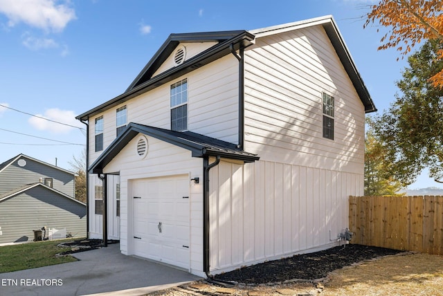 view of side of property with a garage