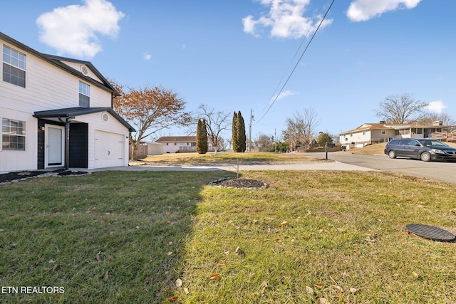 view of yard featuring a garage