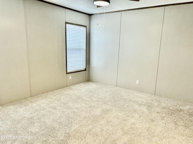 carpeted spare room with a textured ceiling