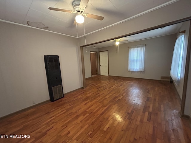 unfurnished room featuring ornamental molding, dark hardwood / wood-style floors, and ceiling fan