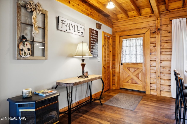 entryway with dark hardwood / wood-style flooring, beam ceiling, and wooden ceiling