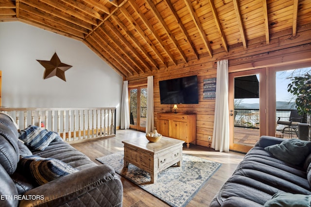 living room with wooden ceiling, light hardwood / wood-style floors, and wood walls