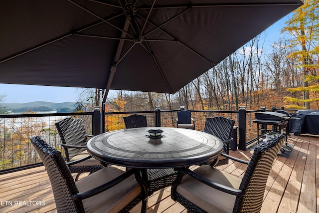 wooden deck featuring a mountain view