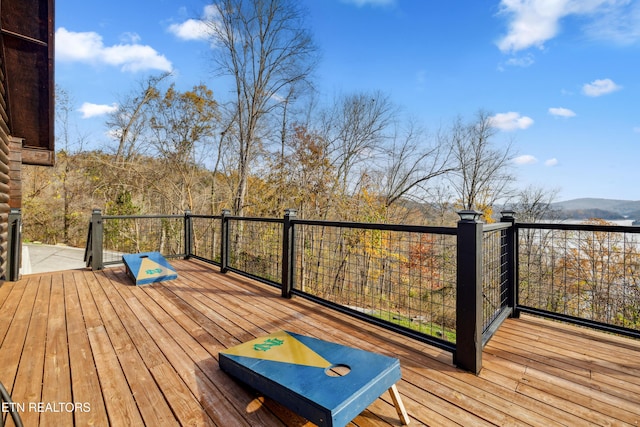 wooden deck featuring a mountain view