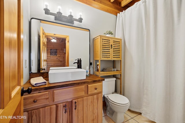 bathroom featuring tile patterned flooring, vanity, and toilet