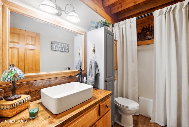 full bathroom featuring toilet, vanity, shower / bathtub combination with curtain, and wood-type flooring