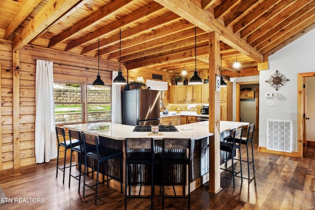 dining area with dark hardwood / wood-style flooring, wooden ceiling, and wood walls