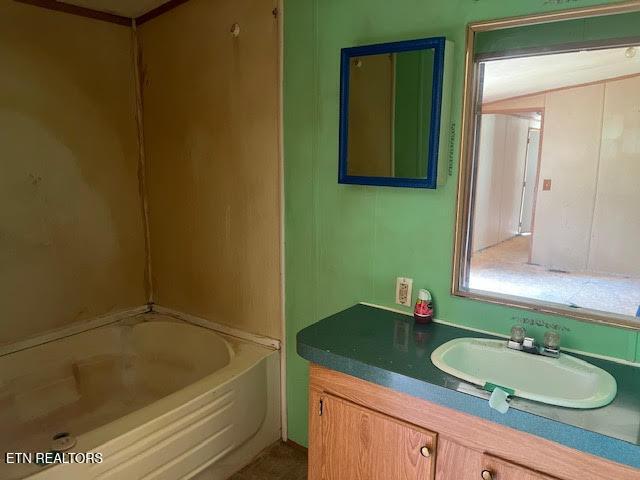 bathroom featuring vanity and shower / bathing tub combination