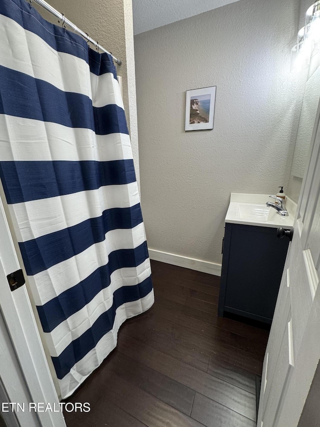 bathroom featuring vanity and hardwood / wood-style floors