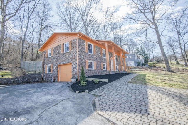 view of side of home with a garage