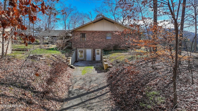 view of front of house with brick siding