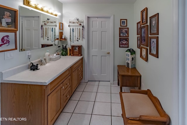 bathroom featuring tile patterned flooring and vanity