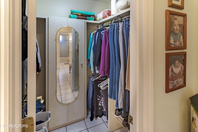 spacious closet featuring light tile patterned floors