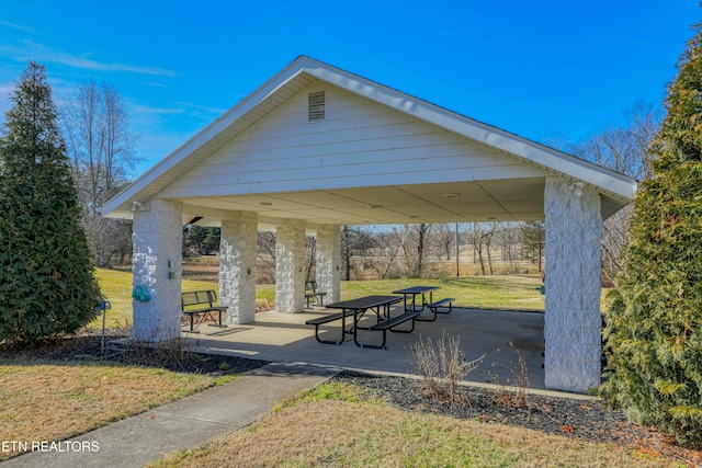 view of property's community with a gazebo and a yard