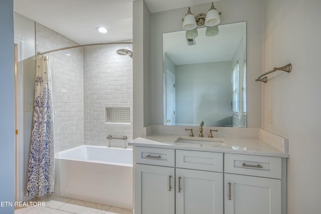 bathroom featuring vanity and shower / bath combo