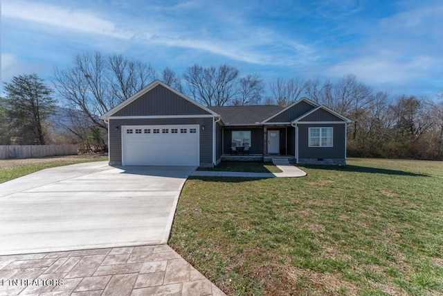 ranch-style house featuring a garage, concrete driveway, and a front lawn