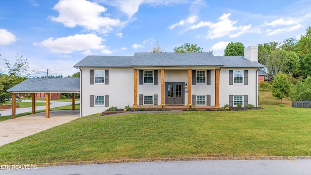 raised ranch with a carport and a front yard