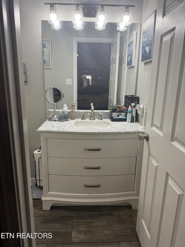 bathroom with vanity and wood-type flooring