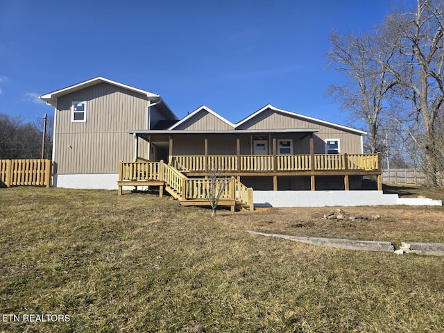 view of front of house with stairs and a front yard