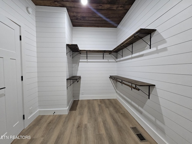 spacious closet with wood finished floors and visible vents