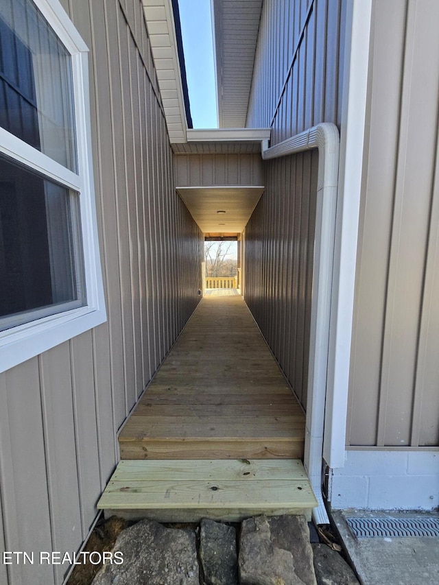 view of exterior entry featuring board and batten siding