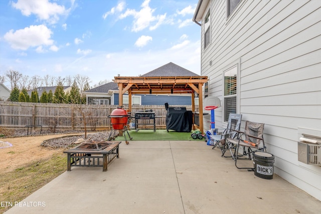 view of patio featuring a fire pit, a gazebo, a fenced backyard, and a grill