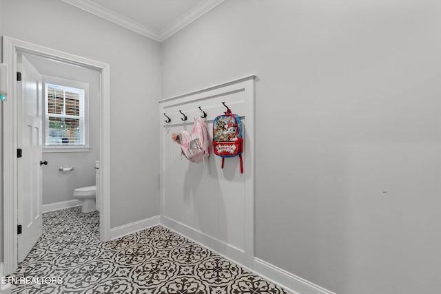 mudroom with crown molding and baseboards