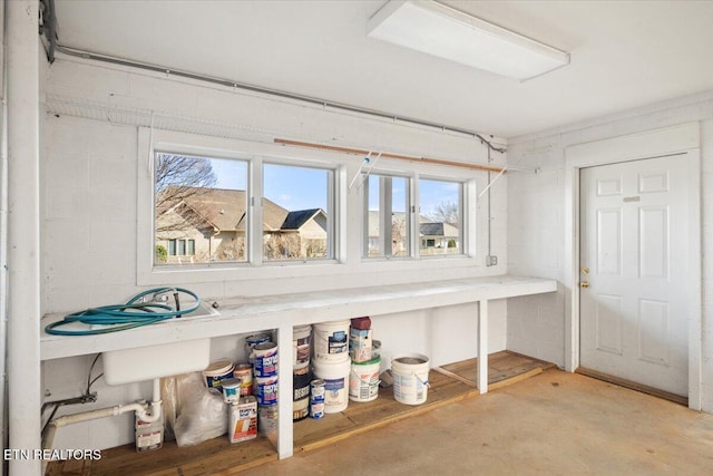 interior space featuring concrete block wall