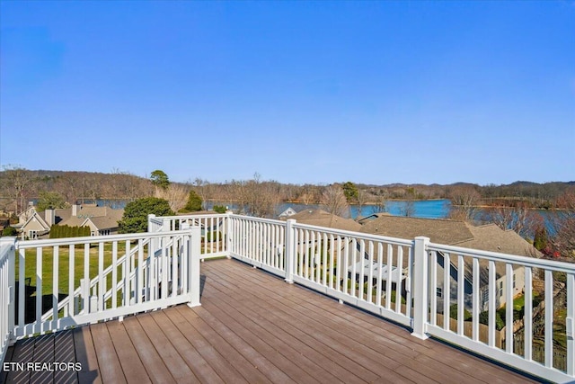 wooden deck with a water view