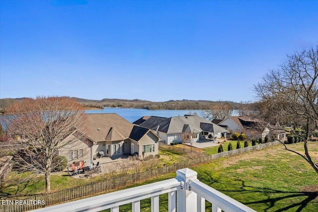 view of water feature featuring a residential view and fence private yard