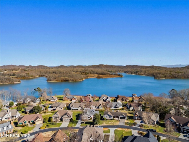 birds eye view of property with a residential view and a water view