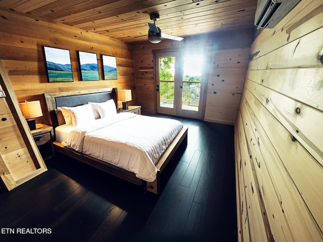 bedroom featuring dark hardwood / wood-style flooring, access to exterior, wood ceiling, and wood walls